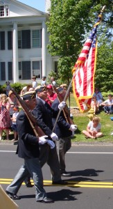 Old Glory leads off the parade